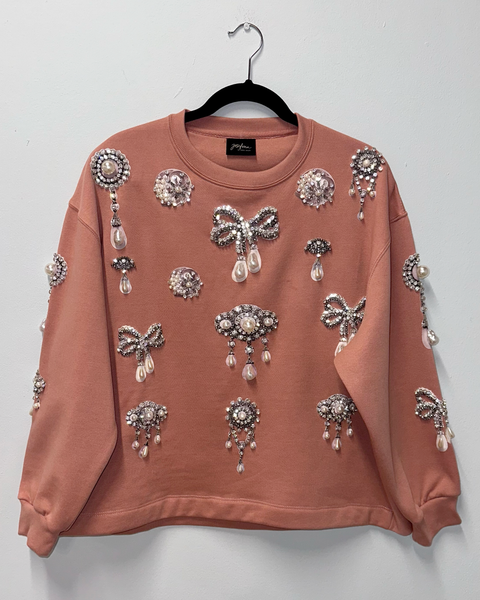 Sudadera dust pink con prendedores