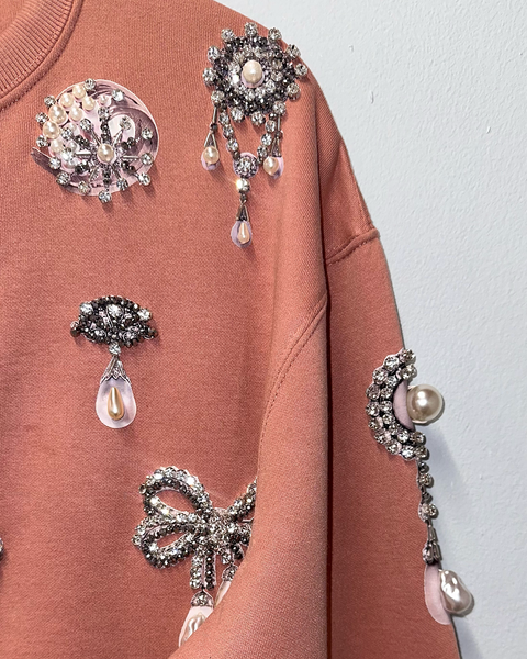 Sudadera dust pink con prendedores