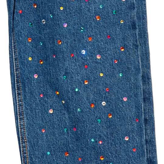 Jeans asimetrico bicolor con cristales