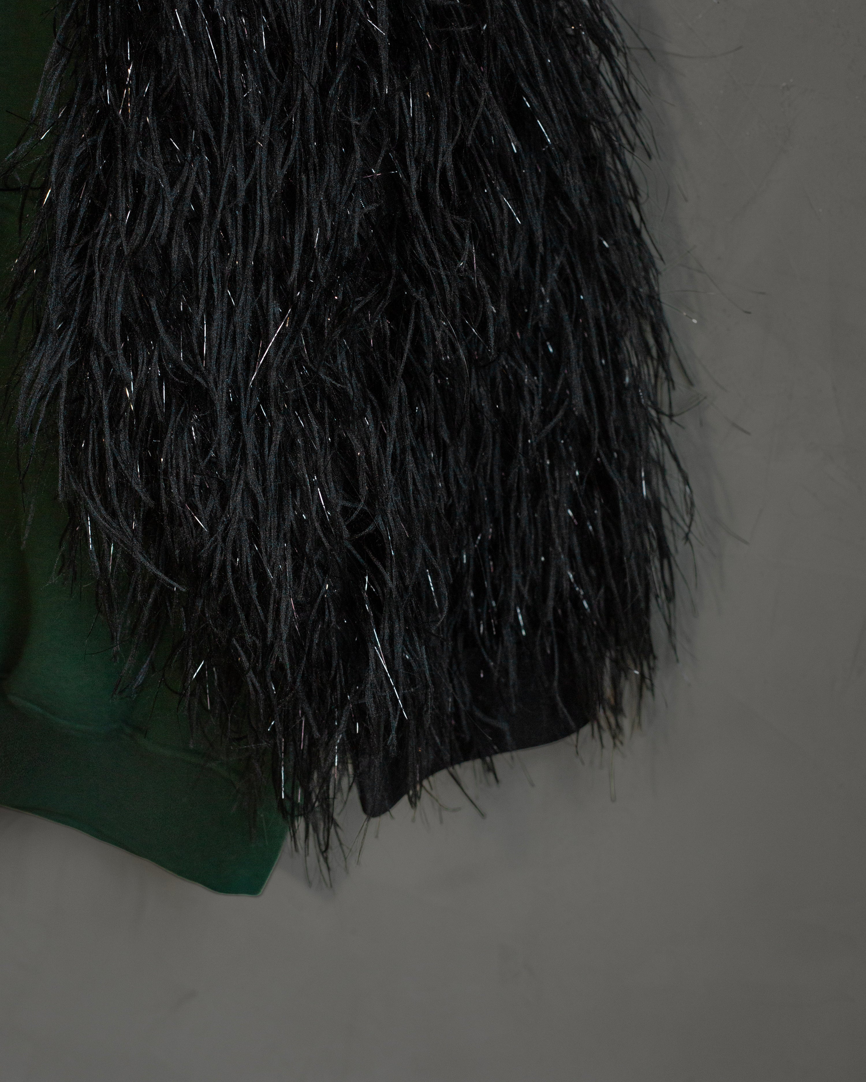 Hoodie lele con plumas