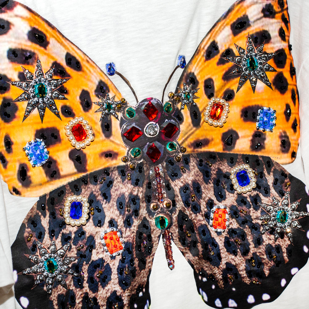 Blusa oversized mariposa con mangas globo