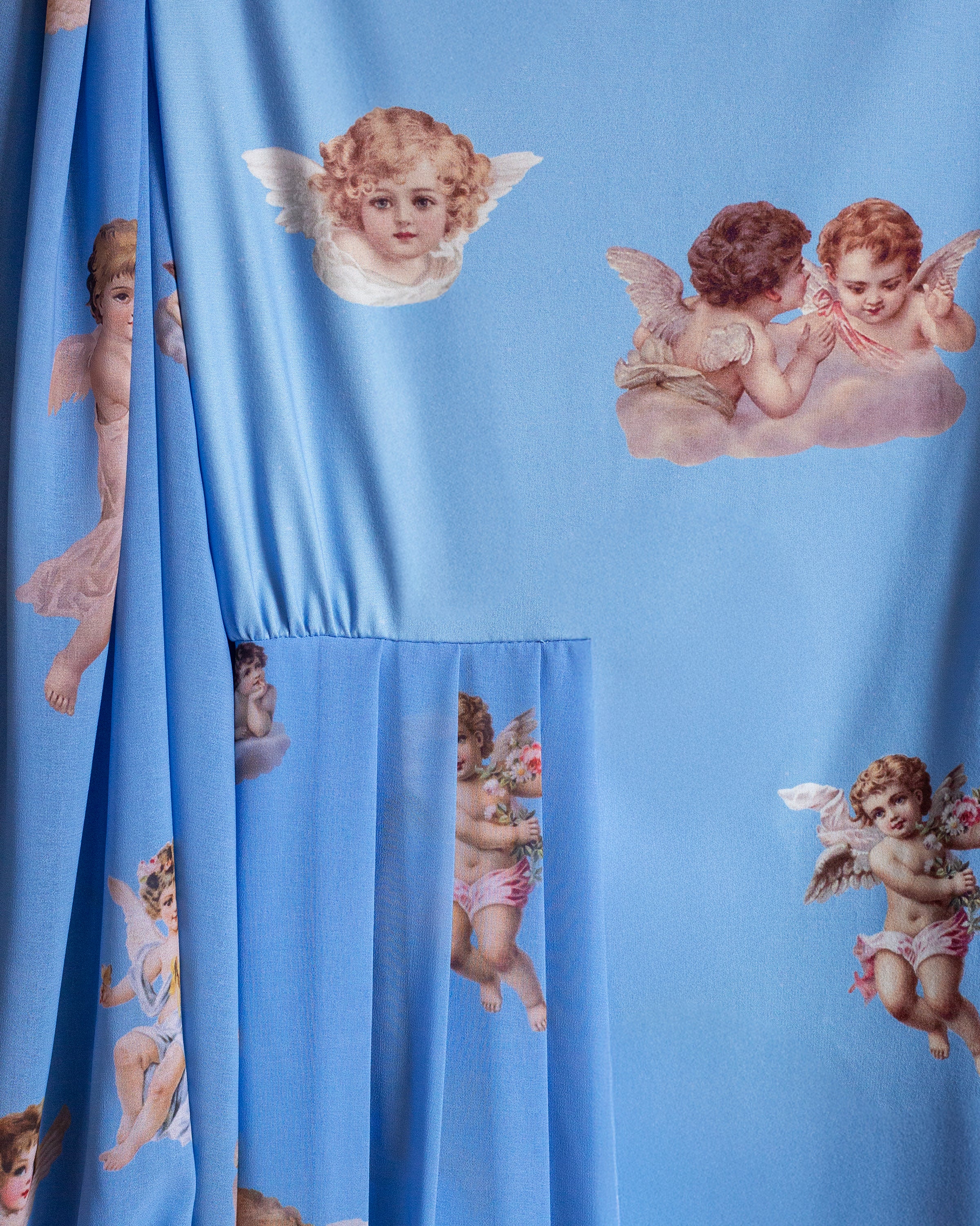 Blusa celeste querubines con faldon