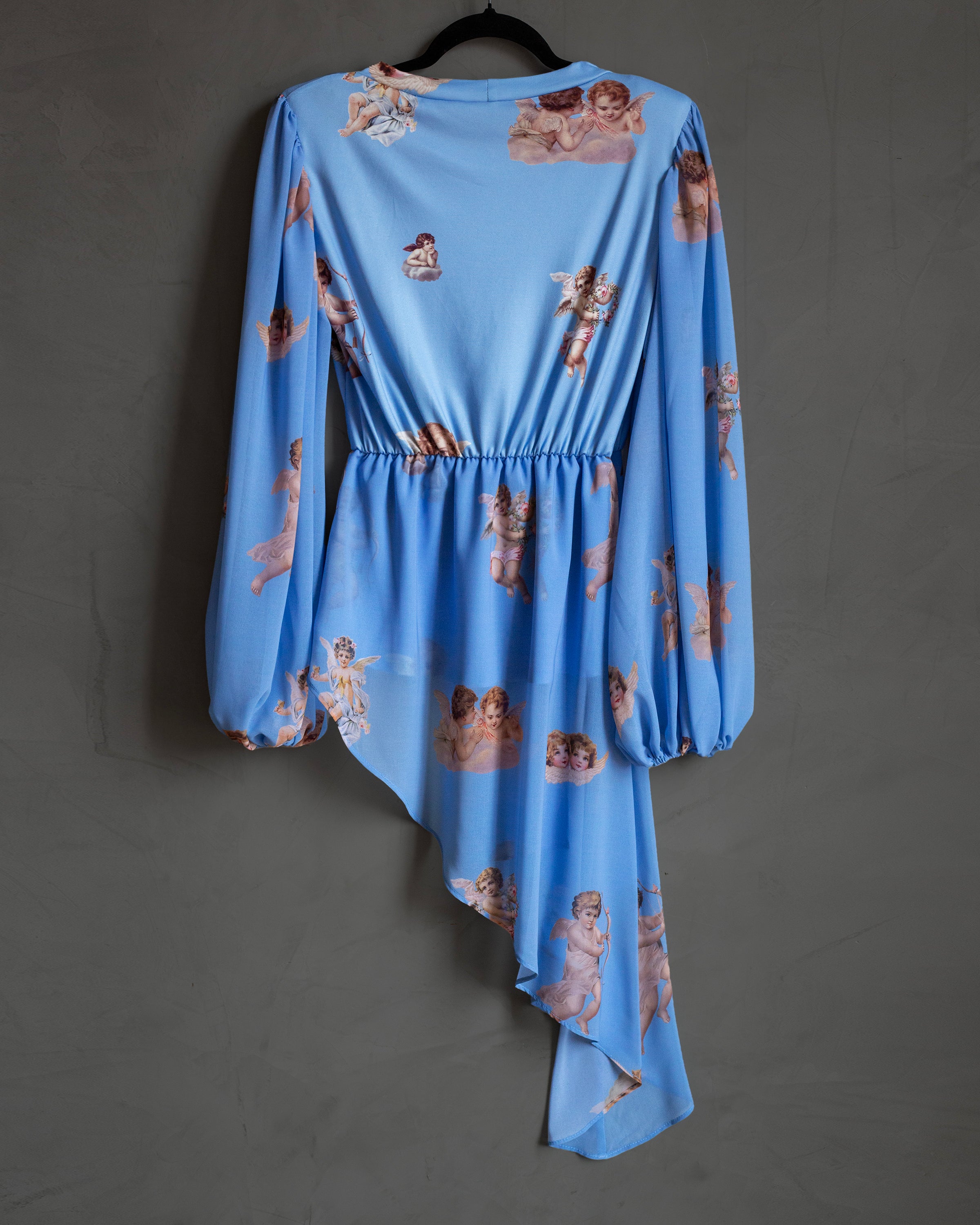 Blusa celeste querubines con faldon
