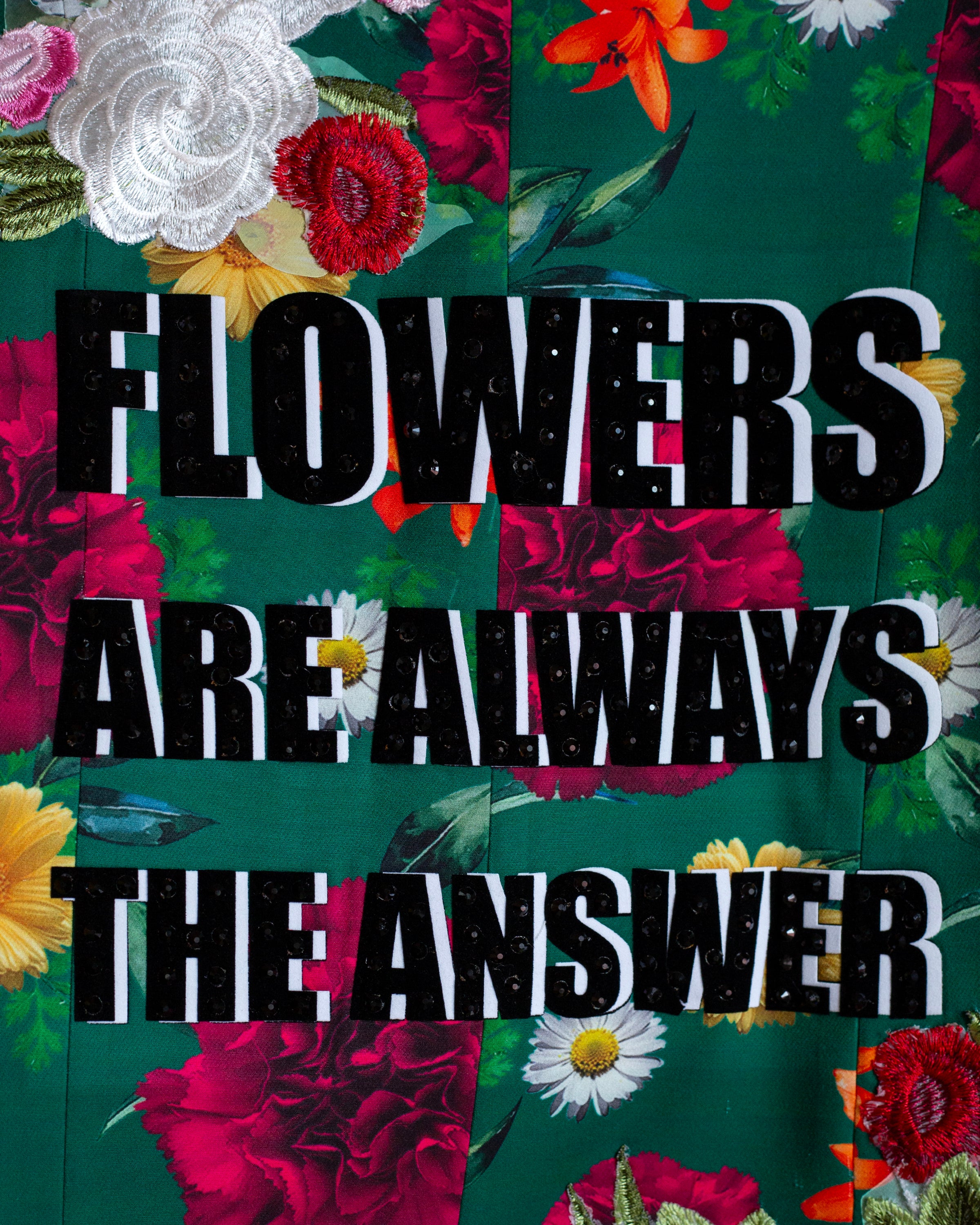 Saco verde con flores "Flowers are always..."