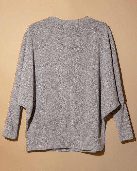 Sweater gris moño con perlas