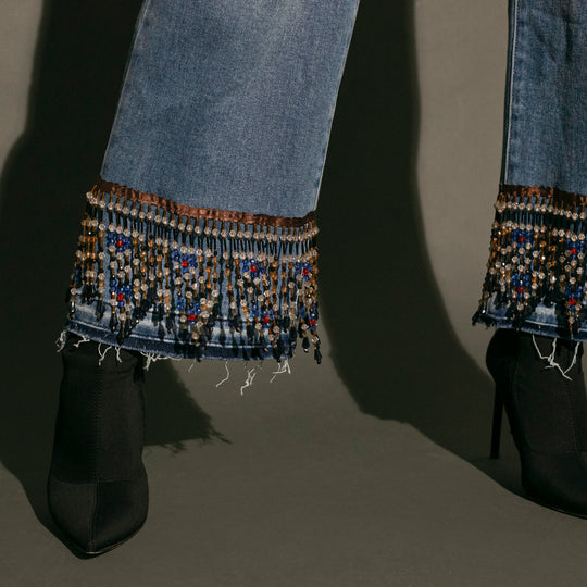 Wide leg jeans con flecos de pedrería